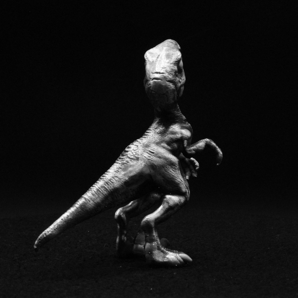 Young Velociraptor hand-poured 999+ silver statue by Gold Spartan